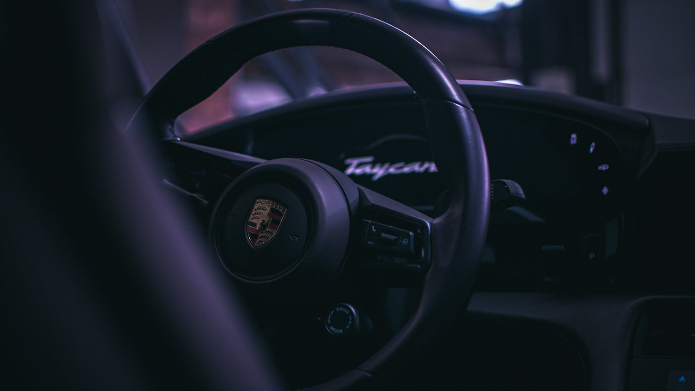 Close-up of a car steering wheel and dashboard