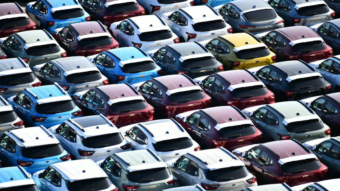 Rows of used cars parked on a dealership lot